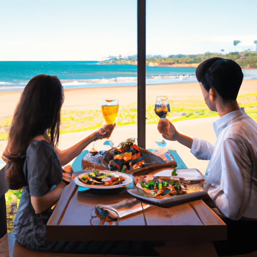 זוג נהנה מארוחת פירות ים טעימה במסעדה על חוף הים